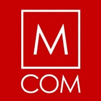 M COM logo