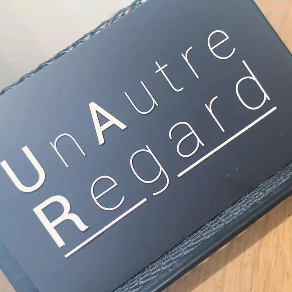 UN AUTRE REGARD logo