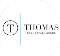 THOMAS REAL ESTATE logo